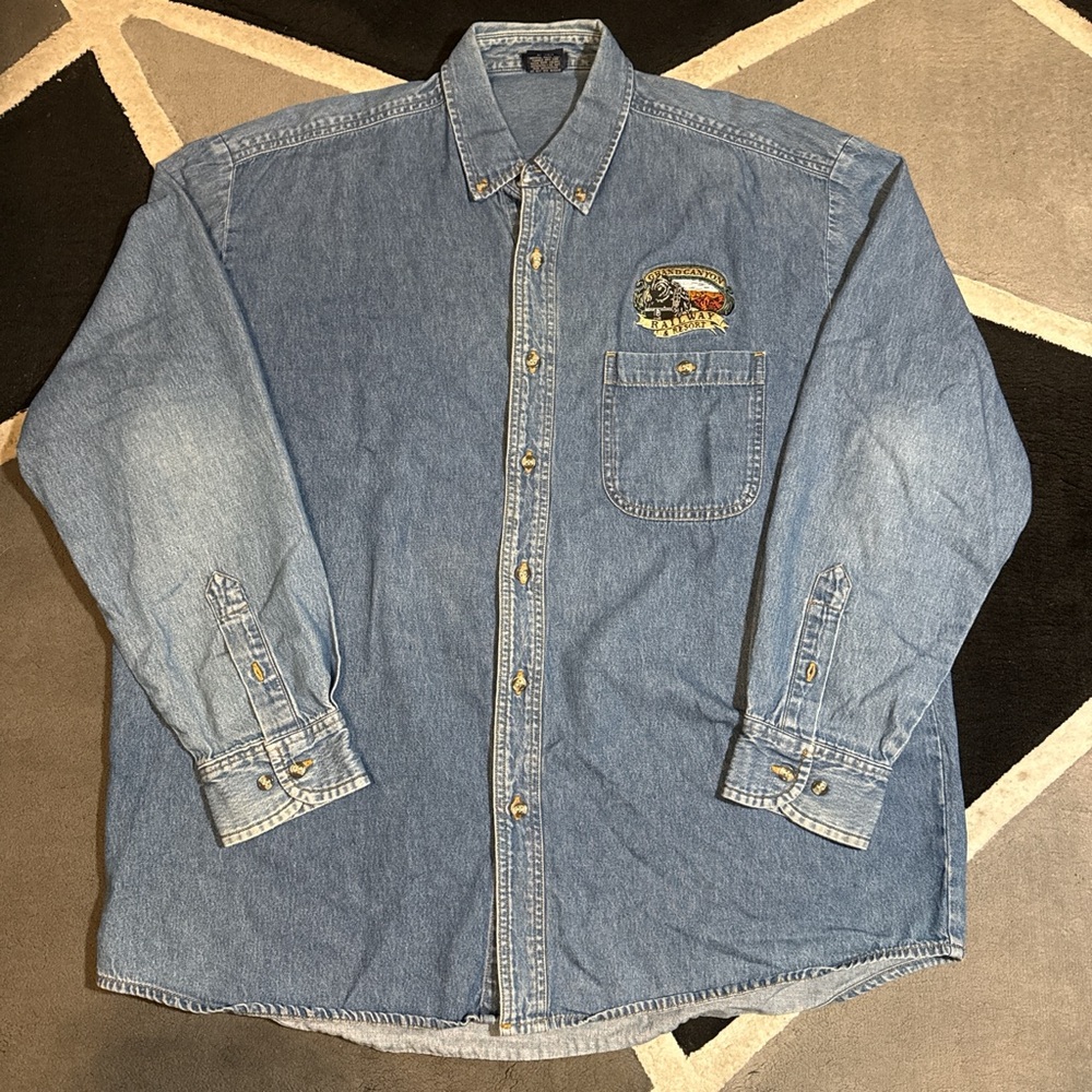 Blue denim button-up shirt with embroidered logo